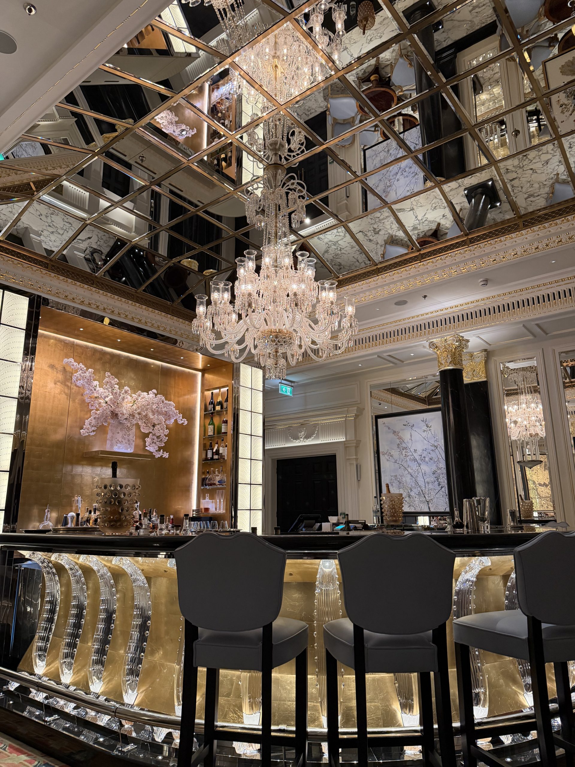 Chandelier and mirrored ceiling at The Dorchester bar in Mayfair